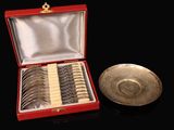 a silver plate and a silver bowl in a red case
