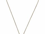 un collier en or avec une tête de lion suspendue à une chaîne
