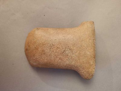 a dog bone on a table with a white background