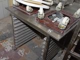 a pile of plates on a table in a kitchen