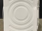 an image of a small white refrigerator in a room