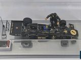 a model of a racing car on display in a glass case