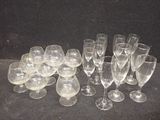 a lot of empty wine glasses on the table