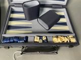 a suitcase with a game set in it on a table