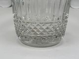 a glass vase that is sitting on a table