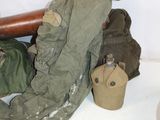 a picture of a pile of clothes and a hat on a shelf