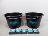 two black buckets filled with pink and blue soap sitting next to each other