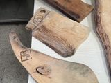 several pieces of wood are sitting on a table in a room