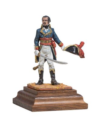 statue of a man in a military uniform holding a sword and a hat