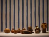 many different types of vases sitting on a table