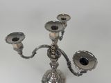 a silver candelab with two candles on it