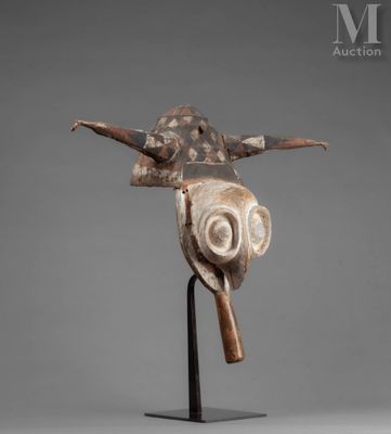 a close up of a sculpture of a bird on a stand