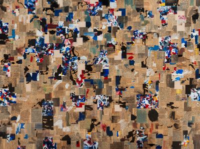 an aerial view of a wall covered in lots of different types of papers