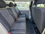 the back seats of a white van with black trims