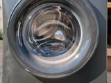 an image of a washing machine outside in the sun