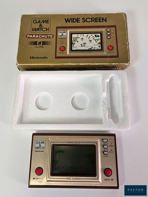 a game and a watch in a box on a table