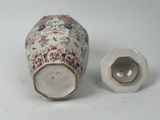 two vases sitting next to each other on a table