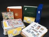 a lot of stamps and books on the table
