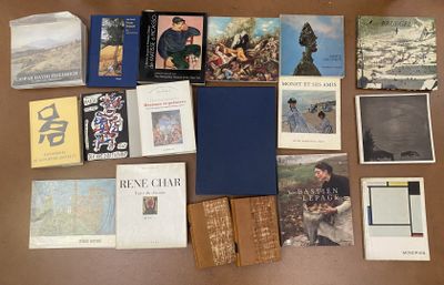 a lot of books on the table with pictures on them