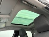a view of the sunroof from inside of a car