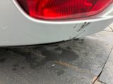 a close up of a car ' s tail light on the street