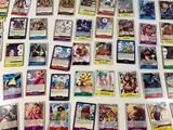 a lot of pokemon cards on the table