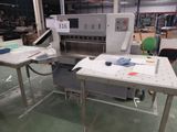 a machine that is sitting on a table in a factory