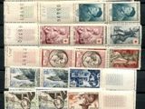 a collection of stamps from different countries on a table