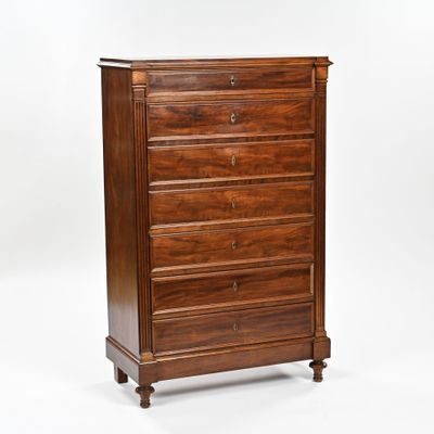 an image of a wooden chest of drawers against a white background