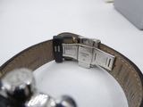 a watch that is sitting on a white table