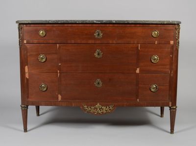 an antique chest of drawers with marble top and brass handles
