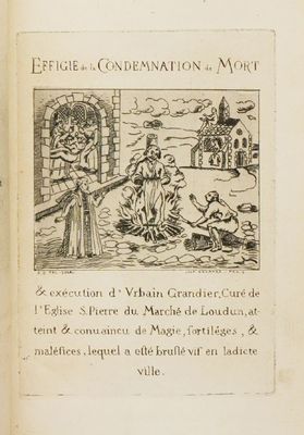 un vieux livre sur lequel figure le dessin d'un homme et d'une femme dans un village
