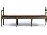 an image of a wooden bench with a leather seat on it