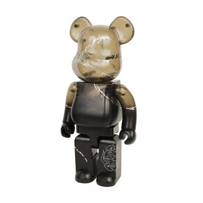 a bear that is standing up with a black shirt on