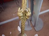 a gold clock that is sitting on a table