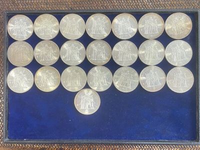 a picture of a display of silver coins in a glass case