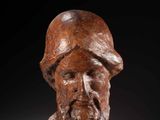 a carved head of a bearded man with a beard