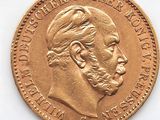 l'image d'une pièce d'or sur laquelle figure le visage d'un homme