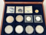 an assortment of silver and gold coins in a wooden case