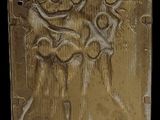 an image of a gold plate with a picture of a man and a woman
