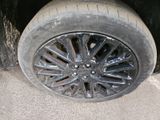 a close up of a tire on the side of the road