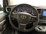 dashboard view of a car with a steering wheel and dashboard controls