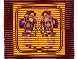 a close up of a red and yellow scarf with two men on it