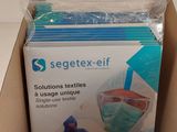 a box of surgical masks in it on a table