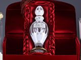 a bottle of perfume sitting inside of a red box