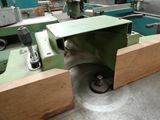 an image of a machine that is working on a piece of wood