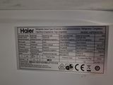 a label on the side of a white refrigerator
