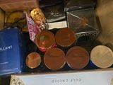 a box with a lot of cosmetics and other items in it