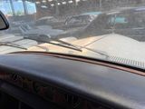 a view of a street from inside of a car