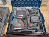 a blue tool case with tools in it on a wooden floor